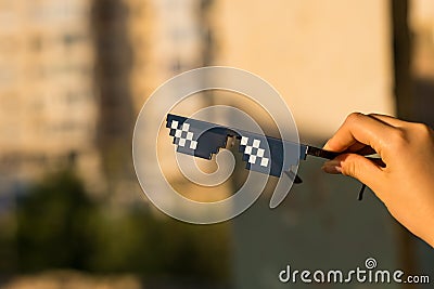 Thug Life Sunglasses shoot in a urban location in a sunny day. Selective focus Stock Photo