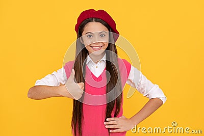 thumb up. back to school. cheerful kid in beret. smiling child has perfect style. teenage beauty Stock Photo