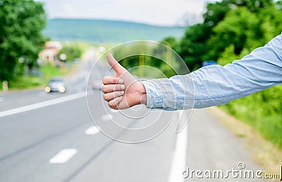 Thumb up gesture meaning. Cultural difference. Hitchhiking gesture. Thumb up inform drivers hitchhiking. But in some Stock Photo