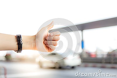 Thumb up is the symbol or sign of help or favor or hitchhike fro Stock Photo