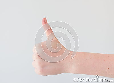 Thumb up on a white background with extra space. minimal concept, positive thinking. Card with copy space for text Stock Photo