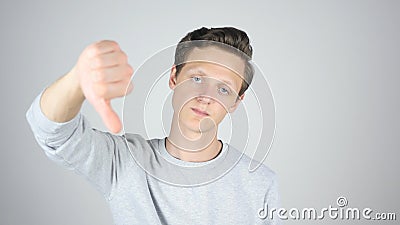 Thumbs Down, Failure, Disagree, Isolated Gesture by Young Man Stock Photo