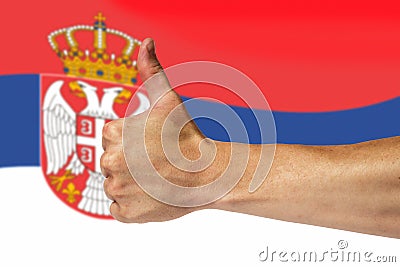 Thumbs up on a background of a flag of Serbia Stock Photo