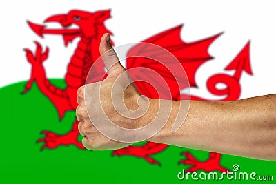 Thumbs up on a background of a flag of Wales Stock Photo