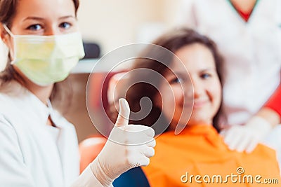 Thumbs up at the dental office Stock Photo