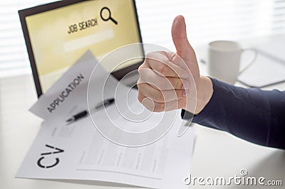 Thumbs up for job search. Applicant with positive attitude. Happy jobseeker. Cheerful man pleased with finding work. Stock Photo