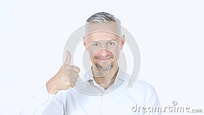 Thumbs Up By Middle Aged Businessman , White Background Stock Photo