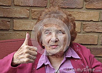 Thumbs up pensioner Stock Photo