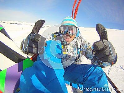 Thumbs up snowboarder Stock Photo