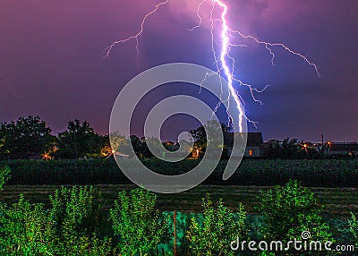 Thunder hitting house in the village Stock Photo
