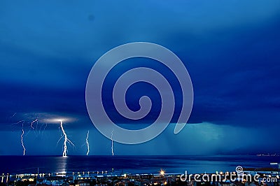 Thunder Storm, lightening, bolt strikes the sea near Rijeka city, on the croatian coastline. Stock Photo