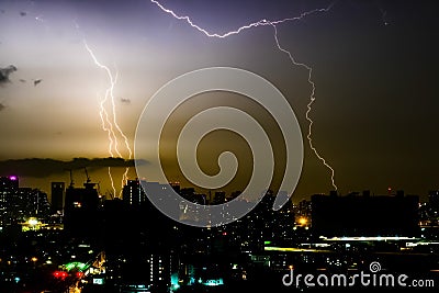 Thunder storm lighting bolt on the horizontal sky and city scape Stock Photo