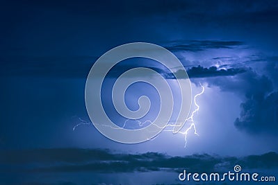 Thunder storm lightning strike on the dark cloudy sky Stock Photo