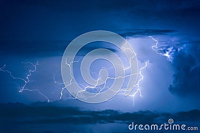 Thunder storm lightning strike on the dark cloudy sky Stock Photo