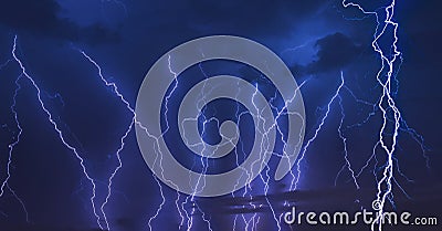 Thunder storm lightning strike on the dark cloudy sky background at night. Stock Photo