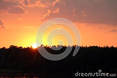 Thunderclouds sunset forest lake Stock Photo