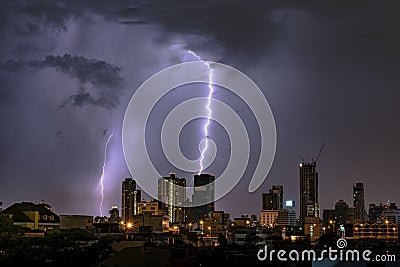 Thunderstorm Lightning Over City Skyline at Night. Stock Photo