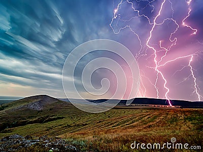 Thunderstorm with lightnings over the fields Stock Photo