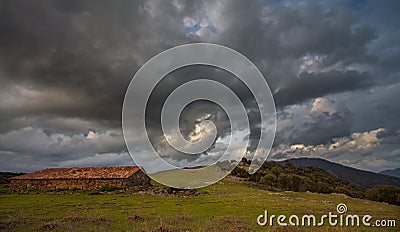 Thunderstorm over traditional sheep stable Stock Photo