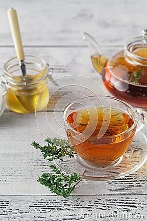 Thyme tea with fresh bunches thyme, thyme inside teacup, white b Stock Photo