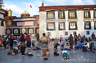 Tibet, Lhasa, China, October, 04, 2013. Buddhists make prostration (prostration) before the first Buddhist temple in Tibet, Jokhan Editorial Stock Photo