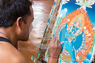 Tibetan artist creates traditional Thangka painting Editorial Stock Photo