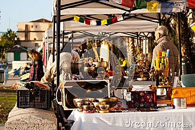 Tibetan bowls. Vintage stuff. Flea market. Golden dishes. Editorial Stock Photo