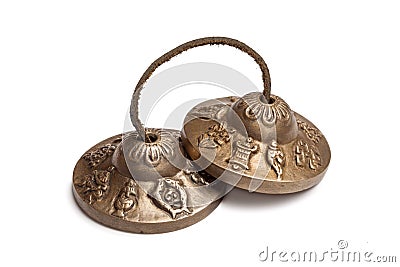 Tibetan Buddhist tingsha cymbals isolated Stock Photo