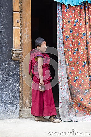 Tibetan Buddhist young monk in the monastery of Lamayuru, Ladakh, India Editorial Stock Photo