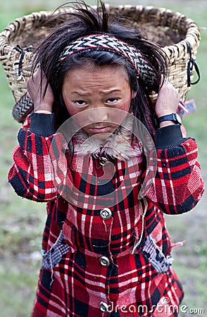 Tibetan girl with basket Editorial Stock Photo