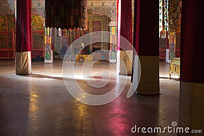 Tibetan monk praying on his own inside the Potala Palace Editorial Stock Photo