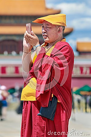 Tibetan monk on sunny Tiananmen Square, Beijing, China Editorial Stock Photo