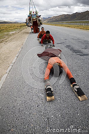 Tibetan on the pilgrimaging road Editorial Stock Photo