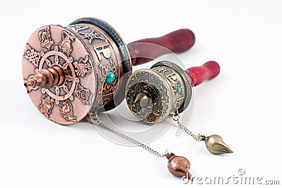 Tibetan portable prayer wheels on a white Stock Photo