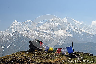 Tibetan prayer flags with Trishul peak during roopkund himalayan trek Stock Photo