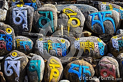 Tibetan religious budhist symbols on stones Stock Photo