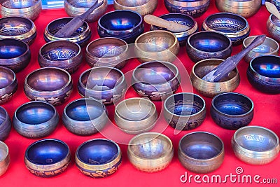 Tibetan singing bowls for sale at the antique market. Singing bo Stock Photo