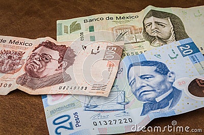 Tickets of 20, 200 and 500 mexican pesos seem to be sad. Editorial Stock Photo