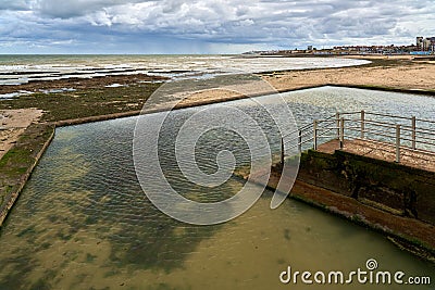 Tidal pool in St Mildreds Bay in Westgate on Sea, Thanet, Kent, UK Editorial Stock Photo