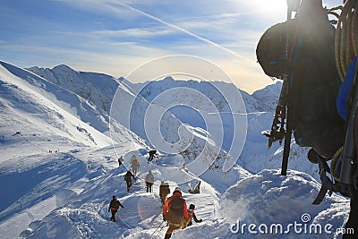 Tied climbers climbing mountain with snow field tied Stock Photo