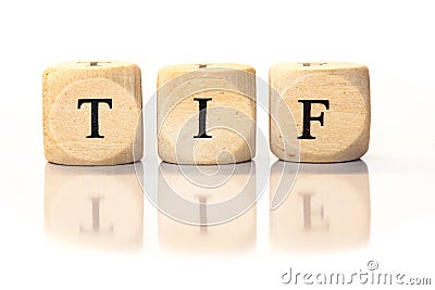 TIF spelled word, dice letters with reflection Stock Photo