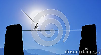 Tightrope Walker Balancing on the Rope Stock Photo