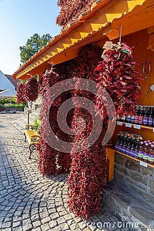 TIHANY, HUNGARY - 25.05. 2018: Dried paprika on the house of wall in Tihany. Editorial Stock Photo