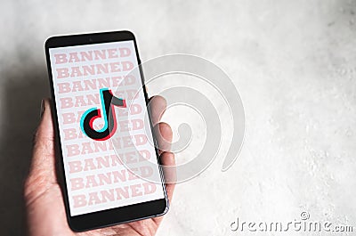 Tiktok logo with Banned signs on phone screen Editorial Stock Photo