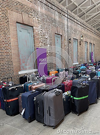 Cruise passengers luggage at a collection point in a cruise terminal. Editorial Stock Photo