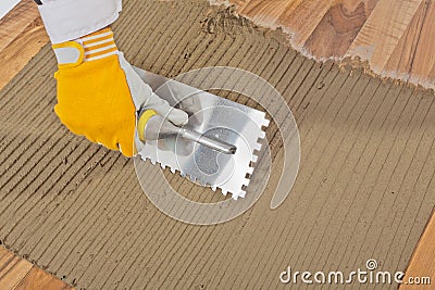 Tile adhesive notched trowel Stock Photo