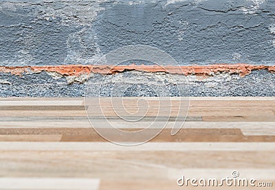 Tile floor collapsed near the house wall Stock Photo