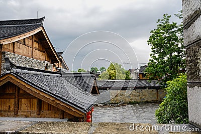 Tile-roofed buildings in cloudy spring after rain,China Stock Photo