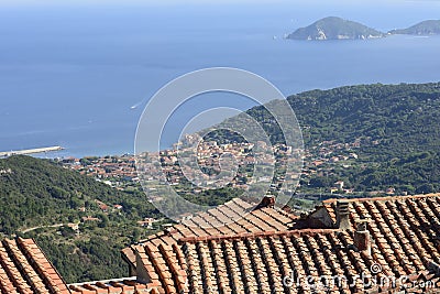 Tile roofs and Marciana Marina view Stock Photo