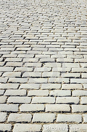 Tiled with paving stone bricks path`s fragment as an abstract background Stock Photo